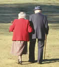Elderly couple walking away